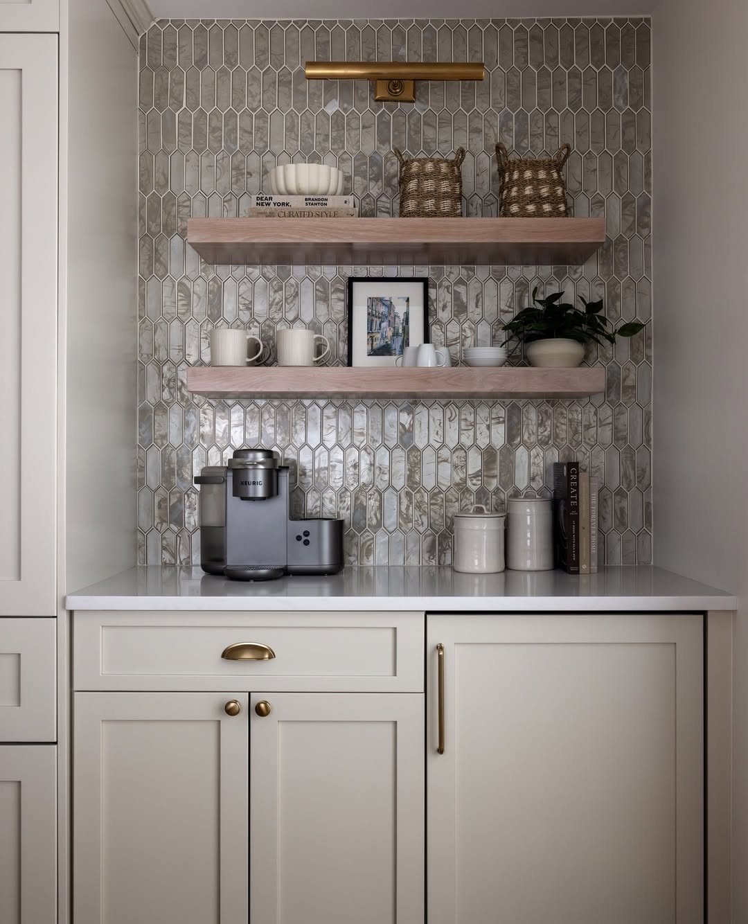 Cream coffee station with pearly picket tile backsplash and light wood shelves