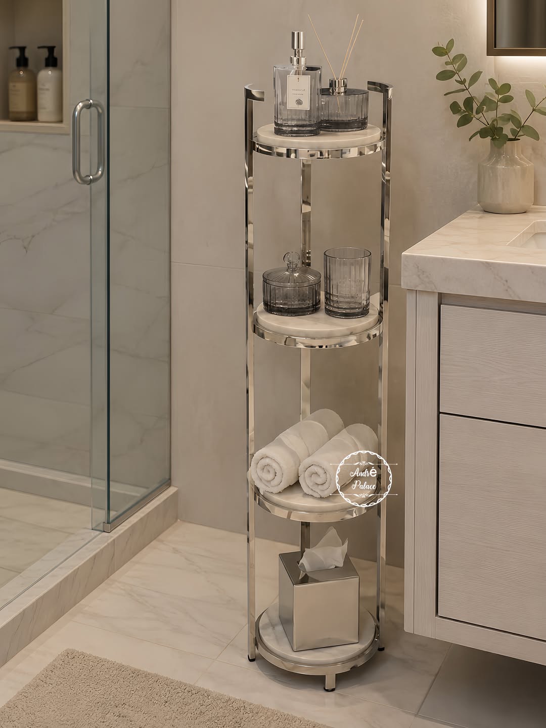 Slim chrome and marble tiered stand beside glass shower and vanity